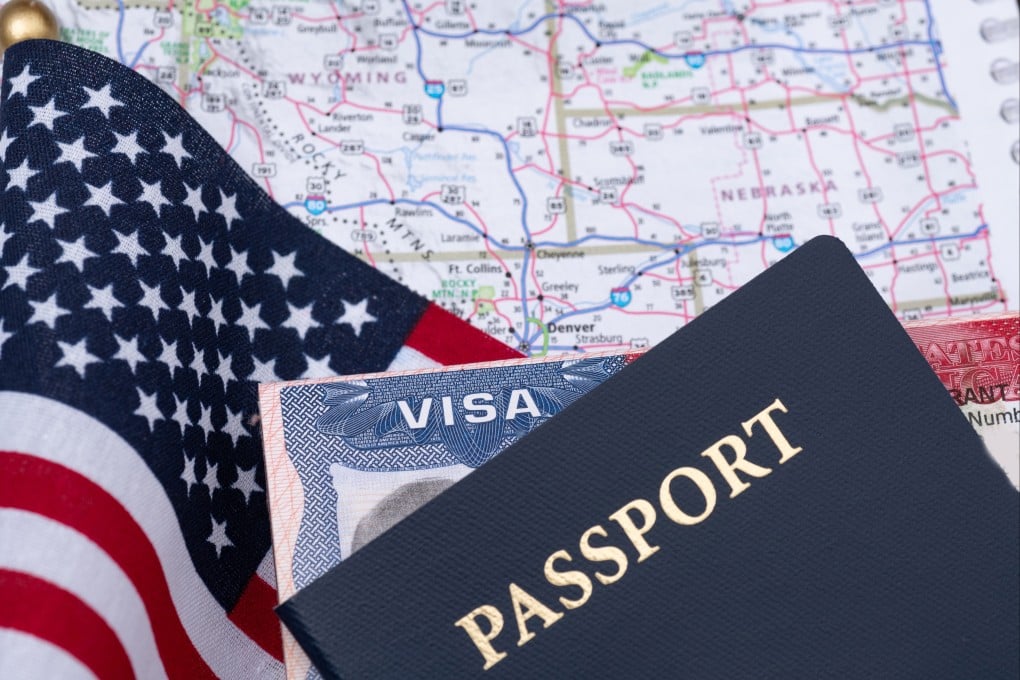 A passport shown with a US visitor visa. Under a planned State Department policy, up to 200,000 tourist and business visas could be revoked. Photo: Shutterstock