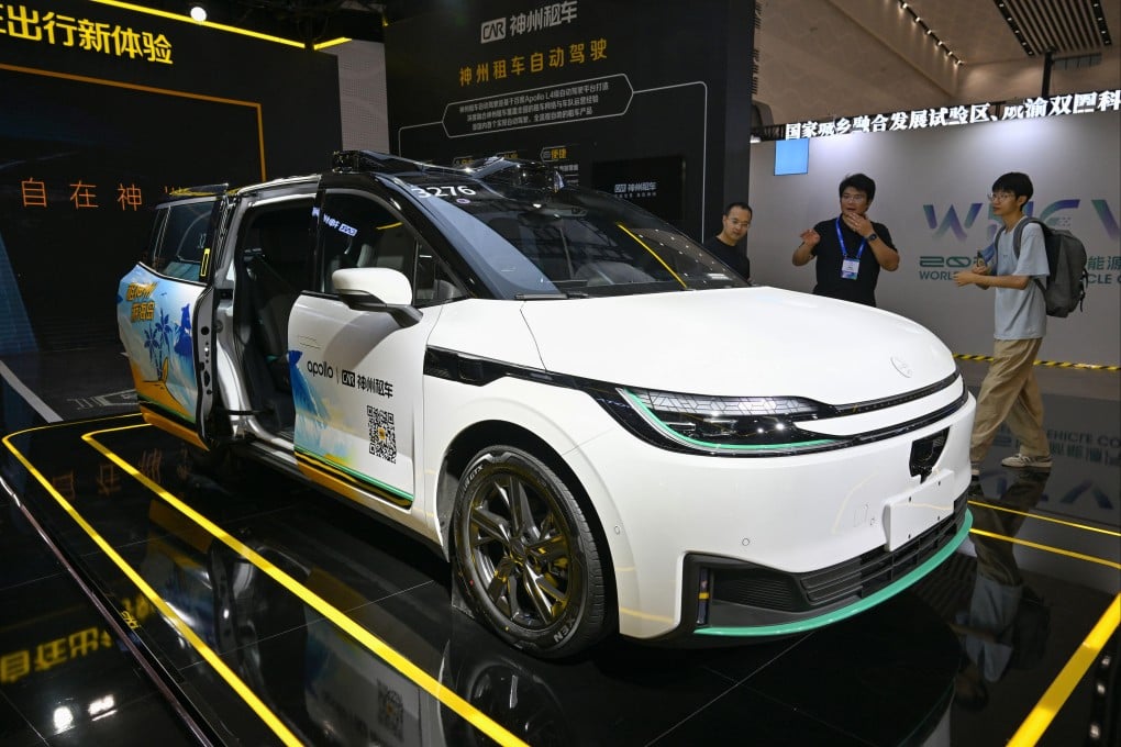 Visitors view an autonomous-driving car for rental service during the 2025 World New Energy Vehicle Congress in Haikou, south China’s Hainan province, on September 27, 2025. Photo: Xinhua