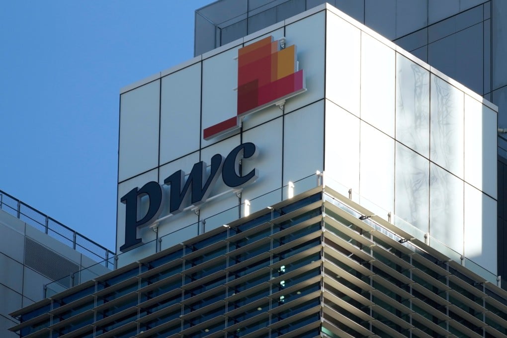 Signage appears on the Australian head office building of PWC in Australia. Photo: AP
