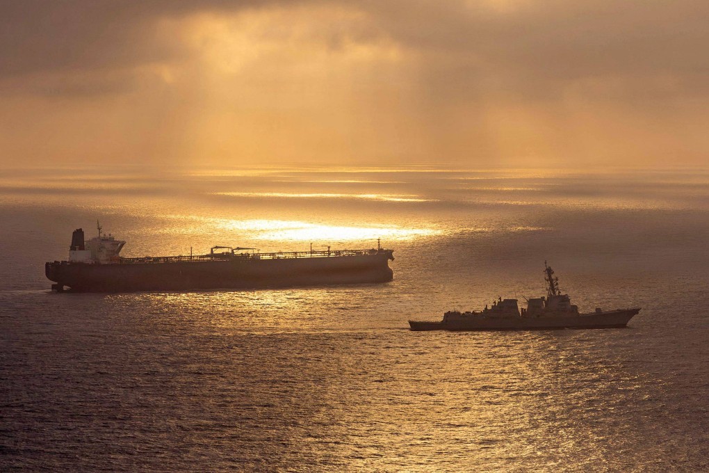A US guided-missile destroyer blocks an Iran-flagged crude oil tanker attempting to sail towards an Iranian port on April 24. Photo: AFP