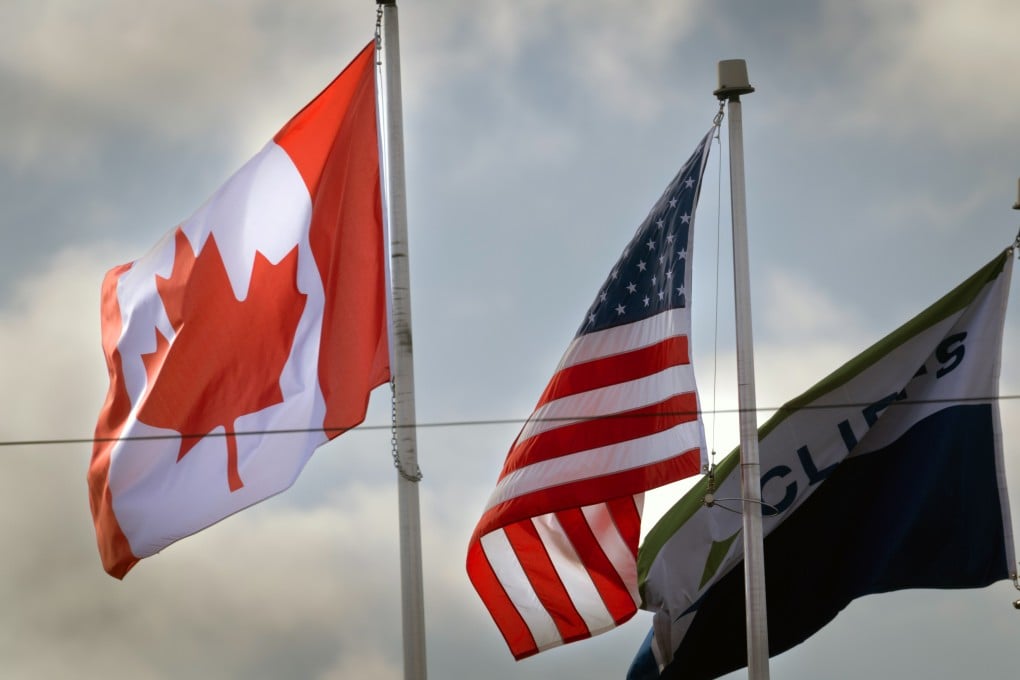 Canadian and American flags fly in Windsor, Ontario, in February 2025. Photo: TNS