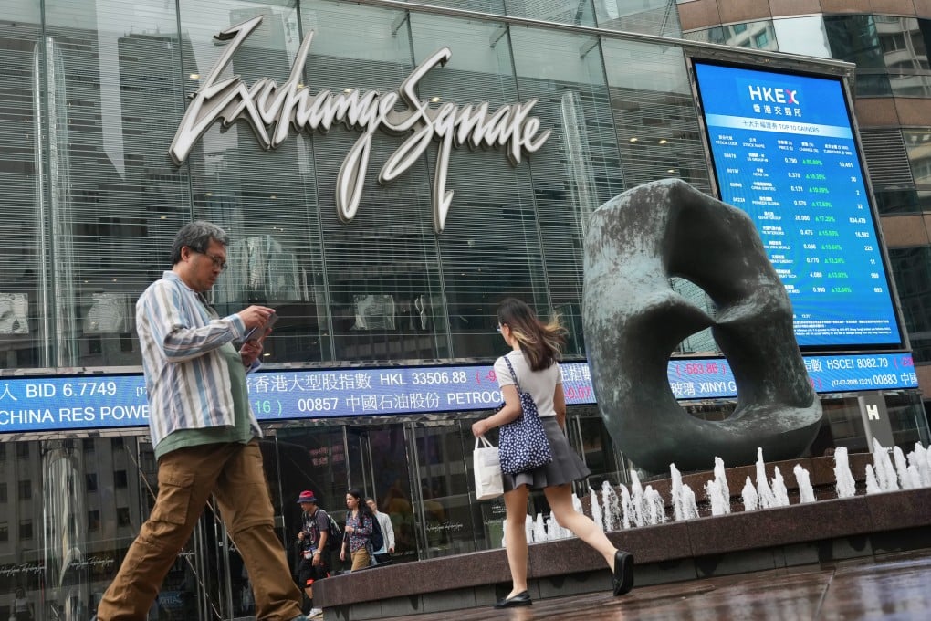 People walk past the Hong Kong Exchanges and Clearing in Exchange Square, Central, on July 17. Photo: Karma Lo