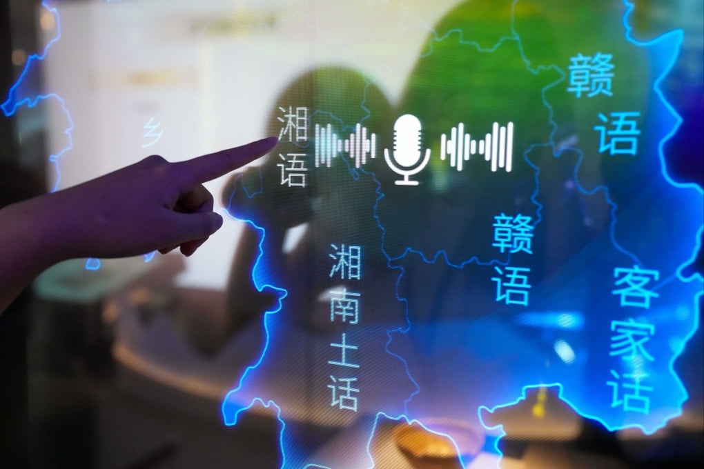 A visitor listens to different regional dialects at a new exhibition hall showcasing recordings and other language materials from across China at the Hunan Museum in Changsha. Photo: Xinhua