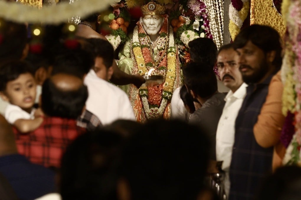 Hindu devotees visit the Sai Baba Temple during the Guru Purnima festival in Bengaluru, India, on July 29. Photo: EPA