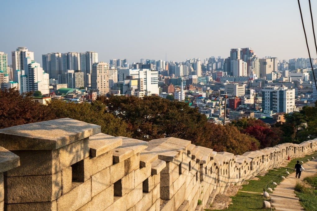 Seoul’s ancient city wall with urban sprawl behind it. South Korea’s capital is a mix of tradition and modernity, and the border with North Korea is just a short journey away. Photo: Shutterstock
