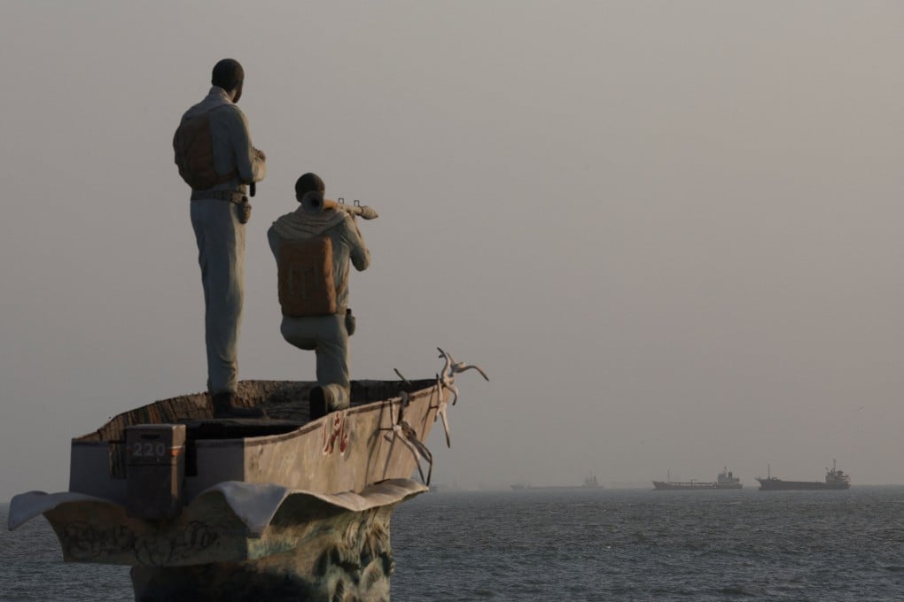 A sculpture of Iranian military members overlooking the Strait of Hormuz in Bandar Abbas. Photo: West Asia News Agency via Reuters