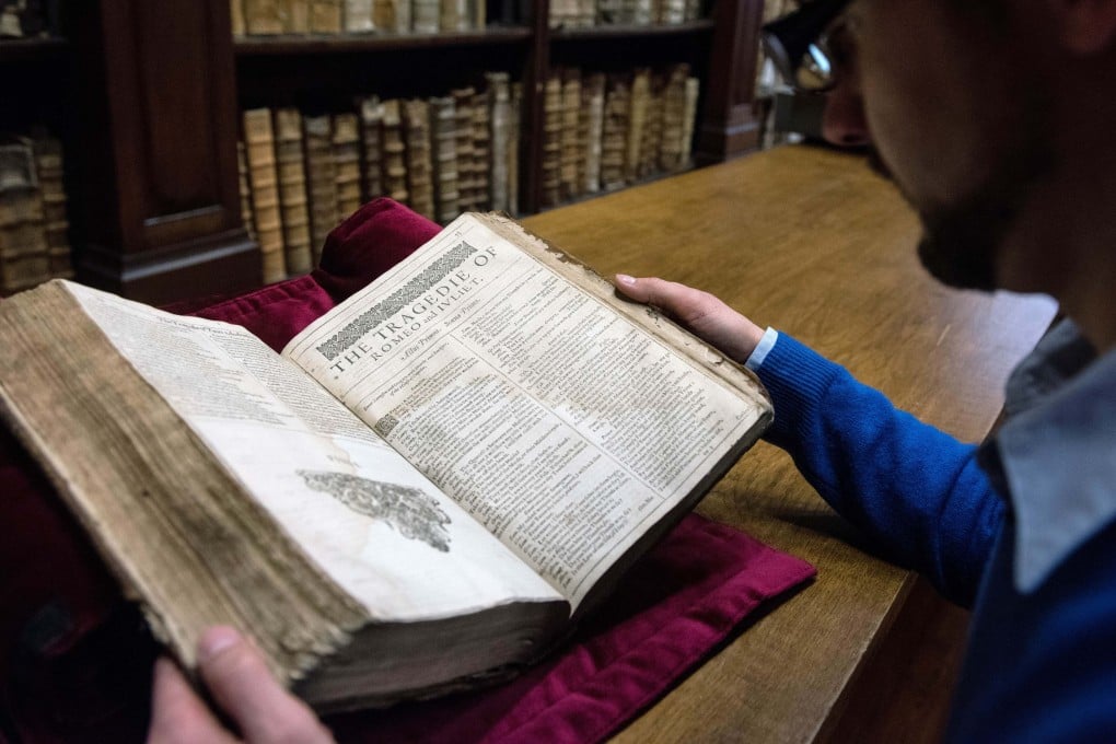 A librarian in the northern town of Saint-Omer, near Calais, carefully shows an example of a valuable Shakespeare “First Folio”, a collection of some of his plays, dating from 1623. Photo: AFP