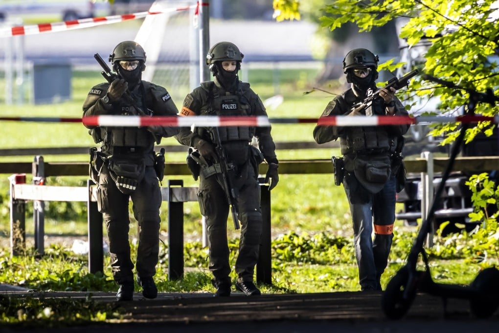 Armed police patrol near the Schachen horse racing track following the shooting in Aarau, Switzerland. Photo: EPA