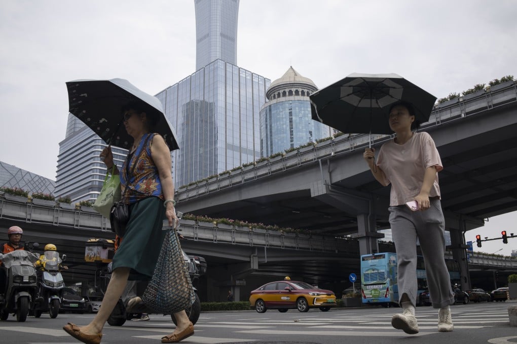 Women in Beijing’s central business district. Photo: EPA