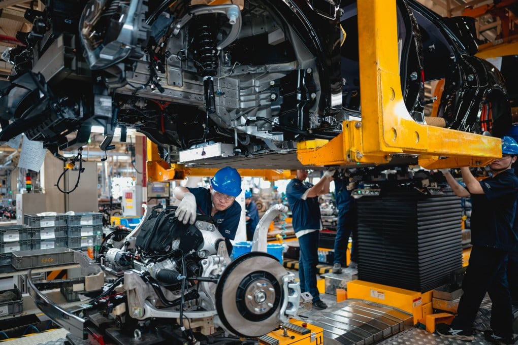 An electric vehicle assembly line in Chongqing, southwestern China. Photo: EPA
