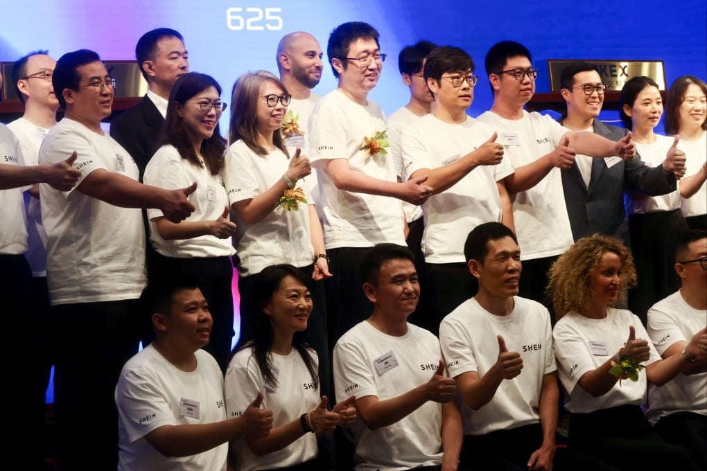 Shein Global Holdings employees, including founder Sky Xu (centre, top row) at the listing ceremony in Hong Kong on Tuesday. Photo: Jonathan Wong