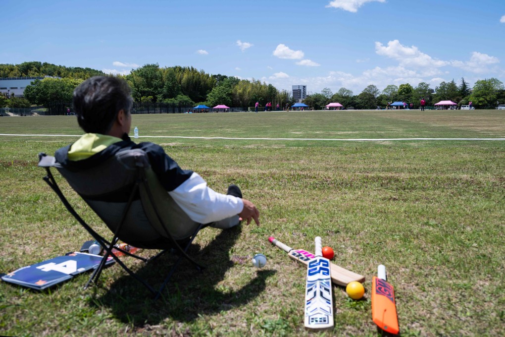 A spectator watches a game between Japan and Vanuatu at the new Nisshin Cricket Ground, which will hosts matches at the Asian Games. Photo: AFP