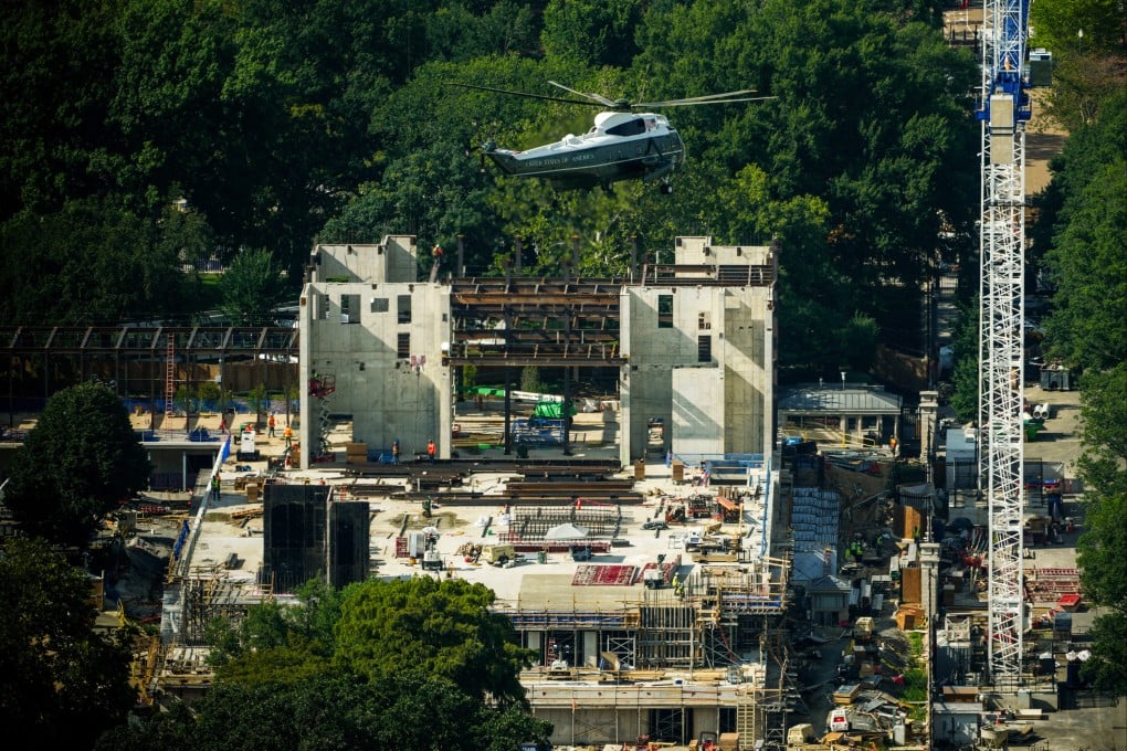 Marine One carrying US President Donald Trump passes over construction on the new White House ballroom. Photo: AP