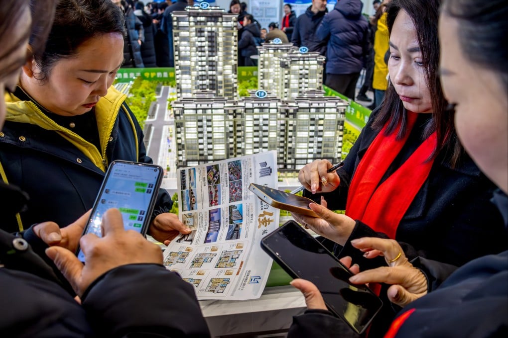 Potential homebuyers study options at a property sales office in Anyang City, China, on January 10, 2026. Photo: Costfoto/NurPhoto via Getty Images