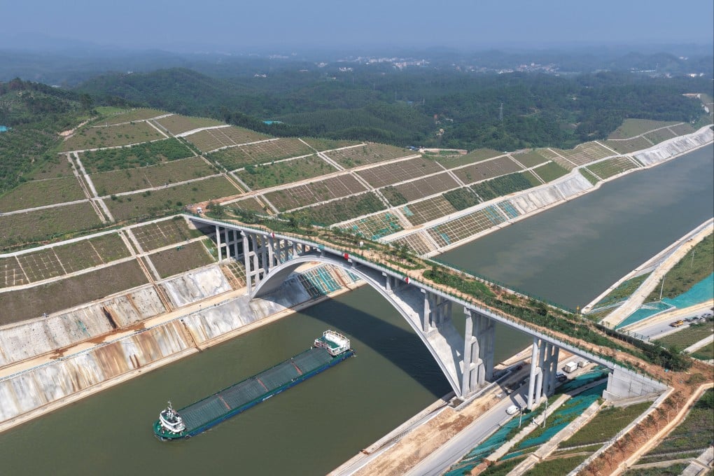 Navigating the Pinglu Canal, a trial vessel moves under a bridge for animals in China’s Guangxi Zhuang autonomous region on August 12. The waterway is expected to open this month. Photo: Xinhua