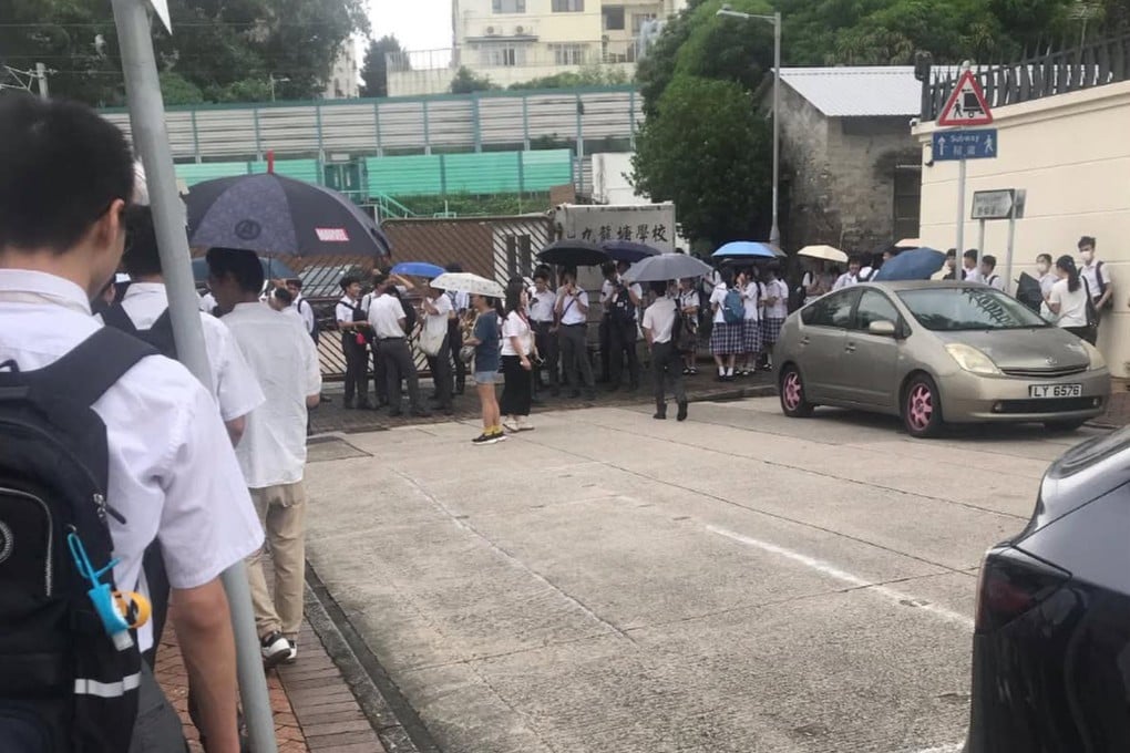Students line up outside Kowloon Tong School (Secondary Section) for uniform and hair checks on Tuesday. Photo: Threads/chipmunk.5284928