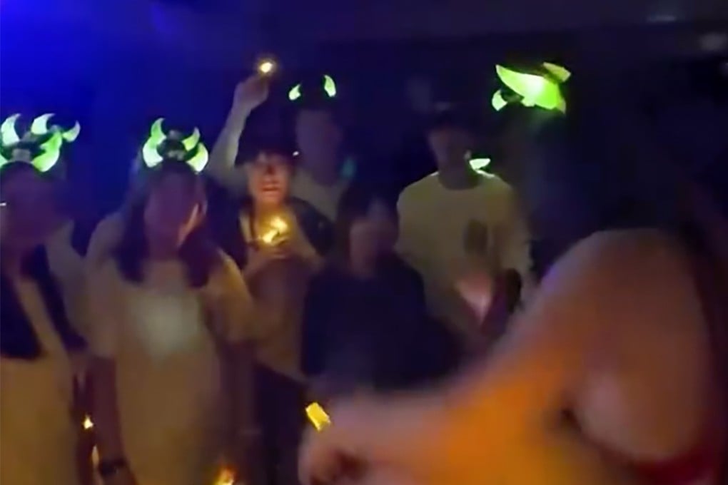 Screenshot of the video showing a half-naked man carrying a woman wearing only a bra and shorts. Photo: Threads