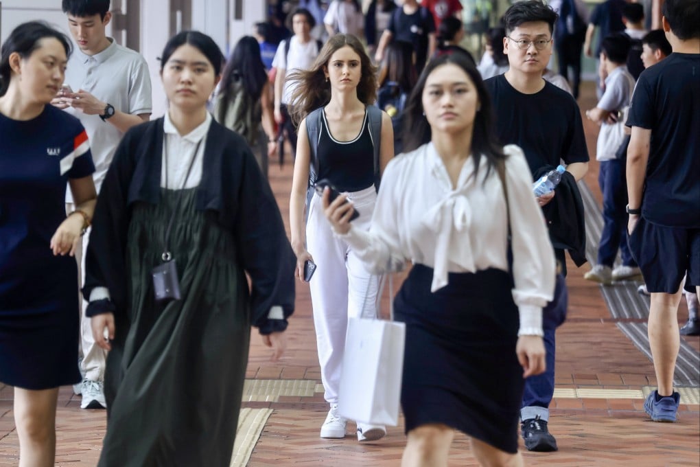 Students on a university campus in Hong Kong in September 2025.  Gen Z is entering the workforce just as AI begins to dismantle the traditional career ladder. Photo: Jonathan Wong