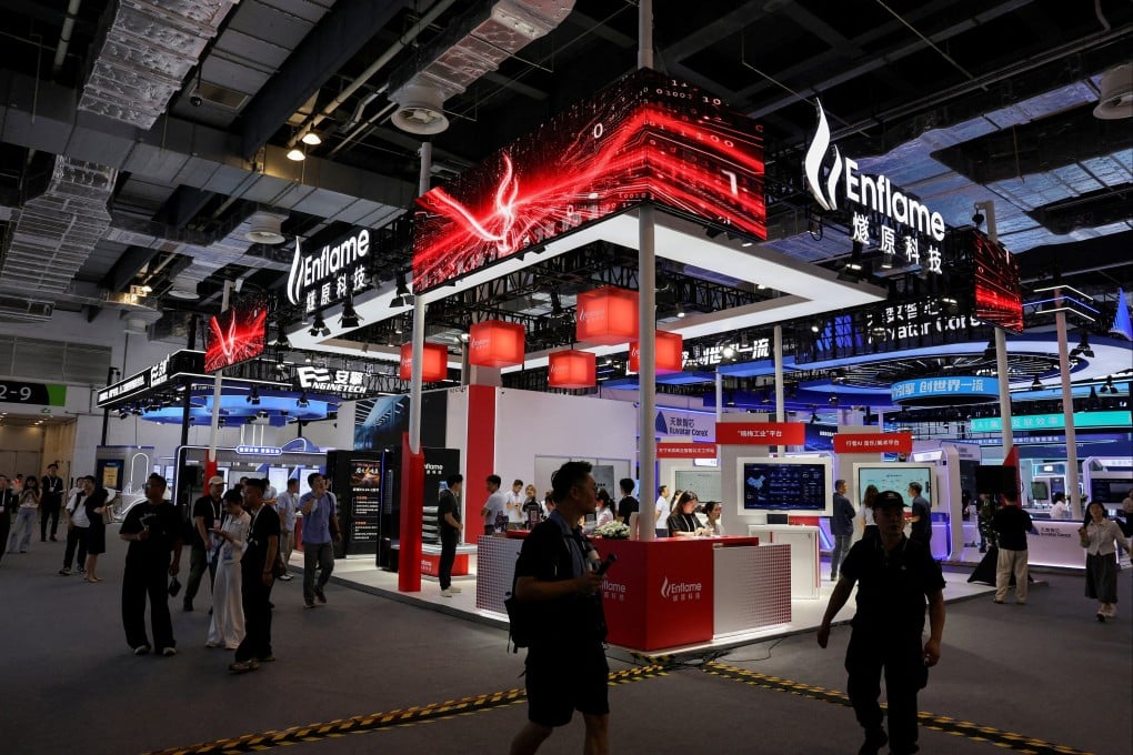 People walk past the Enflame booth during the World Artificial Intelligence Conference in Shanghai on July 17. Photo: Reuters