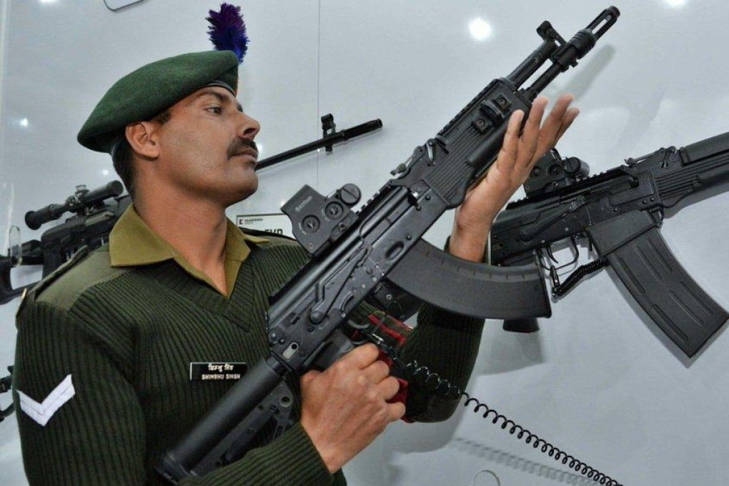 An Indian Army soldier inspects a new AK-203 Sher rifle. Photo: Handout