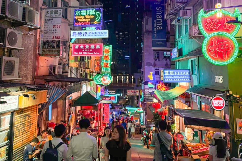 People throng Peel Street in Central on August 13, after a neon-lit Hong Kong streetscape is recreated for a Hollywood production. Photo: Connor Mycroft
