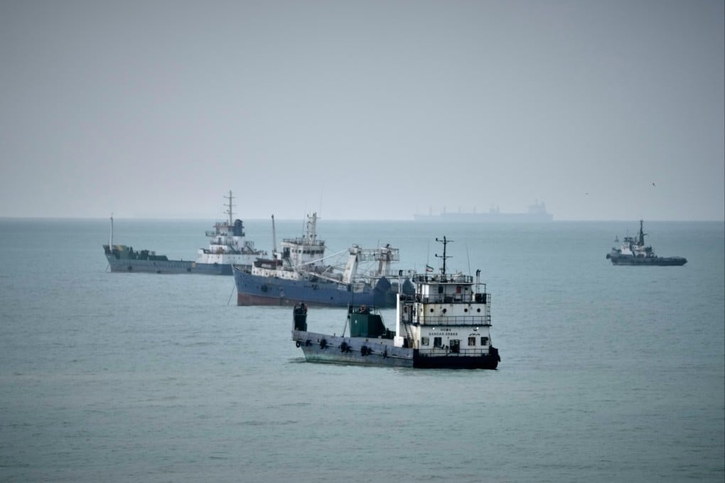 Commercial vessels lie anchored in the Strait of Hormuz off Bandar Abbas, Iran, on Friday. Photo: AP