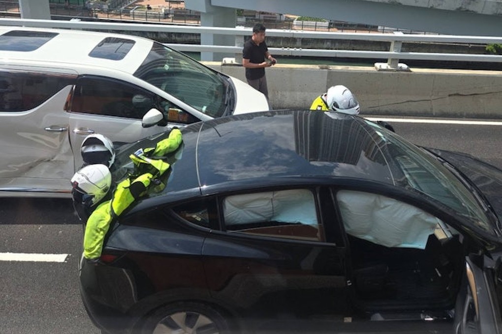 A black Tesla collided with a seven-seater and a third vehicle on Island Eastern Corridor. Photo: Handout