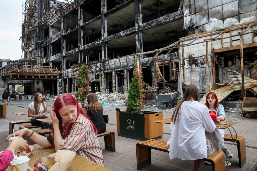 People visit a McDonald’s in Kyiv in an area hit by ​​numerous missile attacks. File photo: Reuters