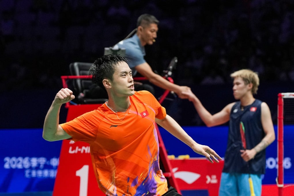 Jason Gunawan celebrates his moment of victory at the China Masters in Shenzhen on Sunday with the vanquished Lee Cheuk-yiu in the background. Photo: Xinhua