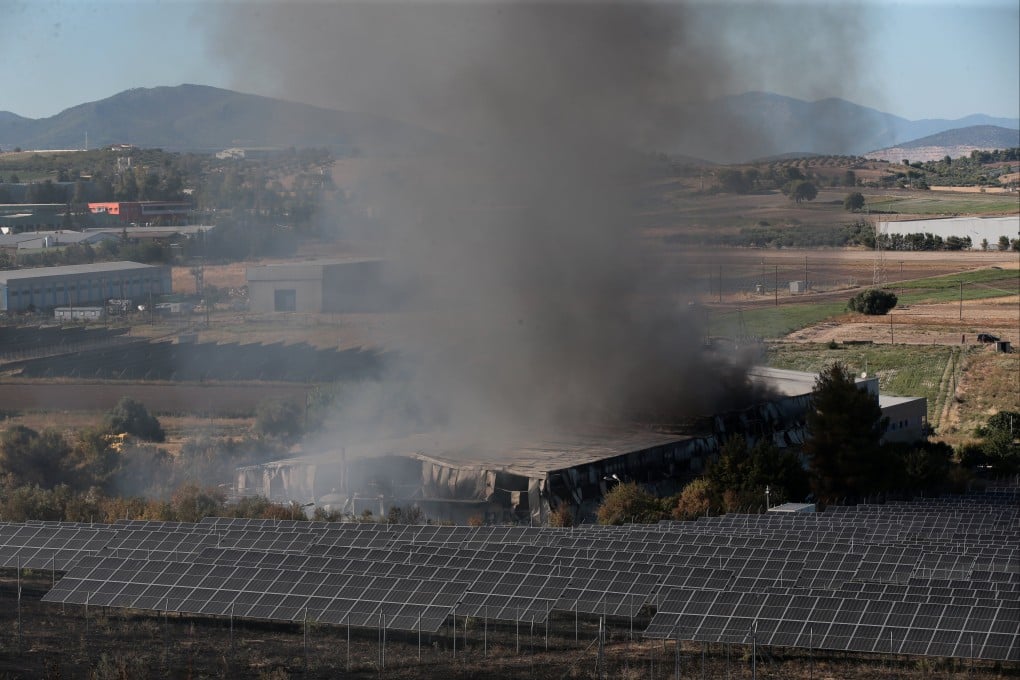 Black smoke from a fire at the area where an F-4 Phantom fighter jet crashed during the Athens Flying Week airshow in Tanagra, Greece on Saturday. Photo: EPA