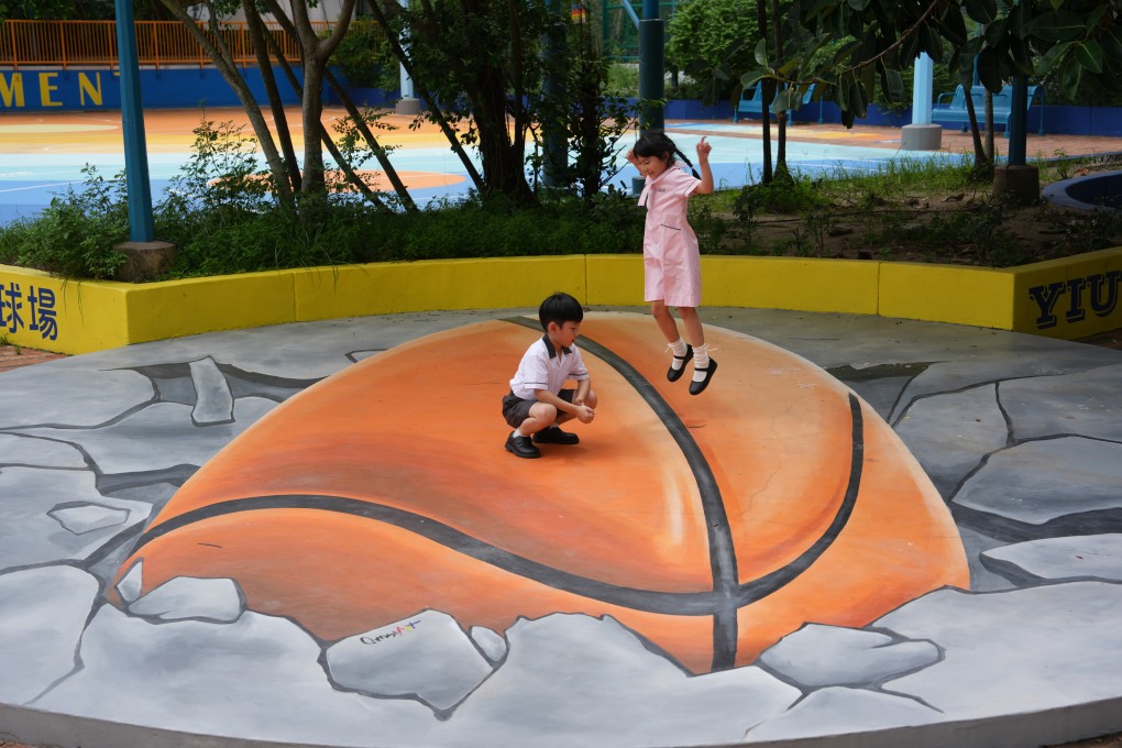 Students play on a 3D painting after school at Yiu Tung Estate, Shau Kei Wan, on September 3. Photo: Sam Tsang
