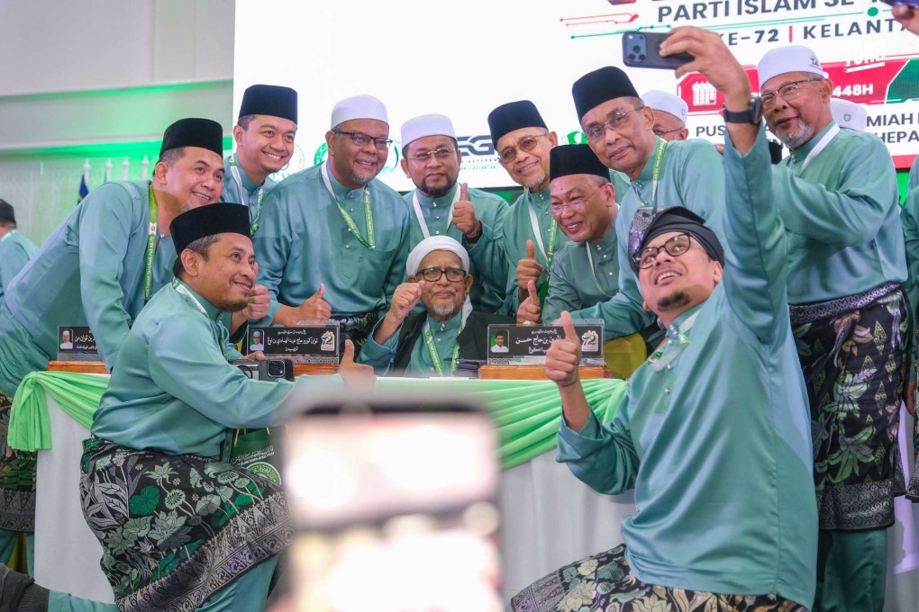 PAS supporters take a selfie with party president Abdul Hadi Awang (centre) during its annual convention in Kota Bharu, Malaysia, on Friday. Photo: Facebook/abdulhadiawang