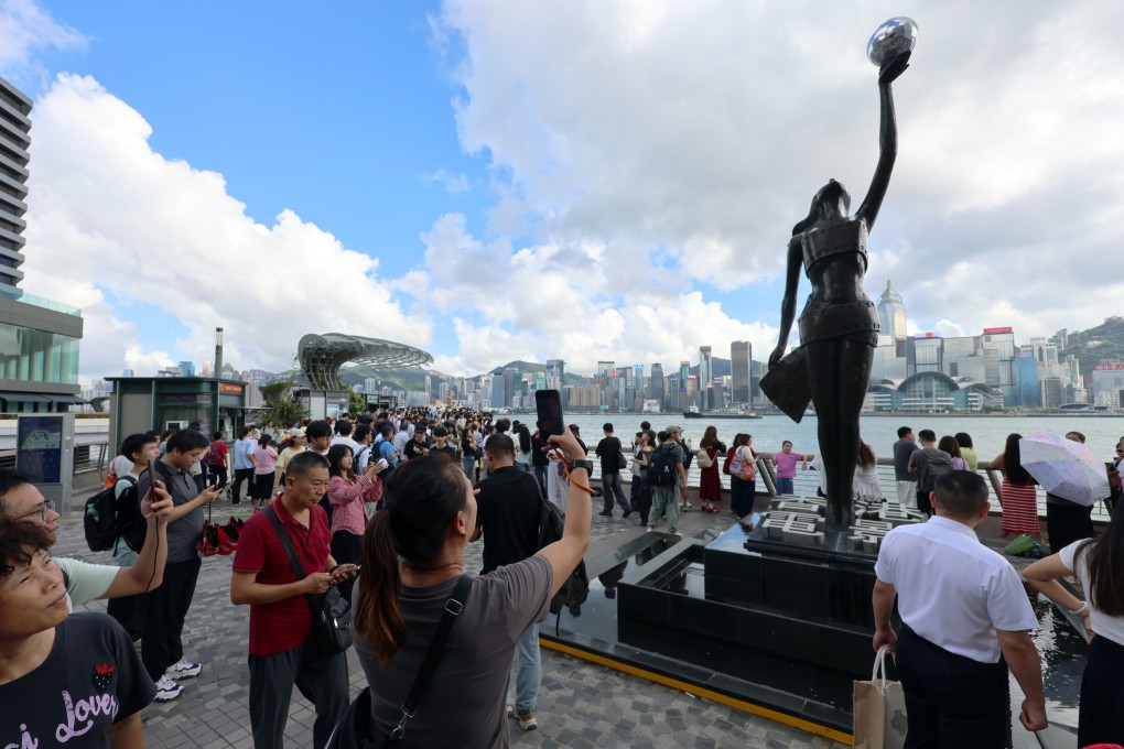 Tourists visit the Avenue of Stars in Tsim Sha Tsui. Photo: Jelly Tse