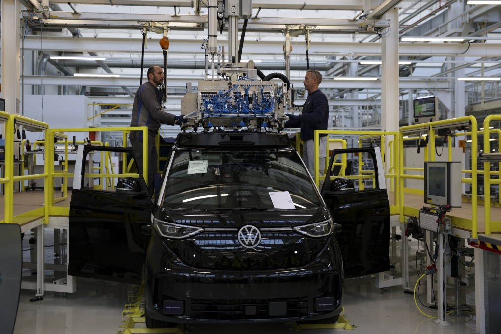 Workers on the assembly line at a Volkswagen electric car factory in Hanover, Germany, on March 4. The carmaker has launched an investigation into the dismissal of 107 newly hired university graduates by its Chinese supplier, Changzhou Xingyu Automotive Lighting System. Photo: EPA