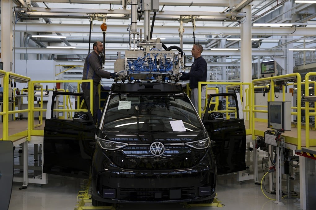 Workers on the assembly line at a Volkswagen electric car factory in Hanover, Germany, on March 4. The carmaker has launched an investigation into the dismissal of 107 newly hired university graduates by its Chinese supplier, Changzhou Xingyu Automotive Lighting System. Photo: EPA