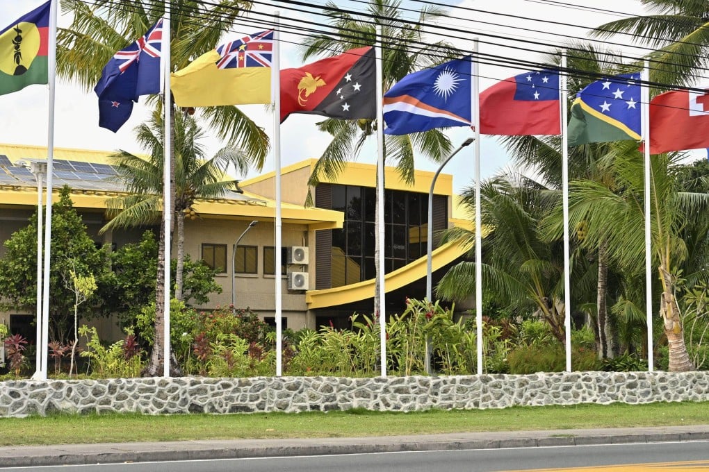 Member nations’ flags fly outside the Pacific Islands Forum leaders’ meeting in Koror, Palau, on September 3. Photo: Kyodo