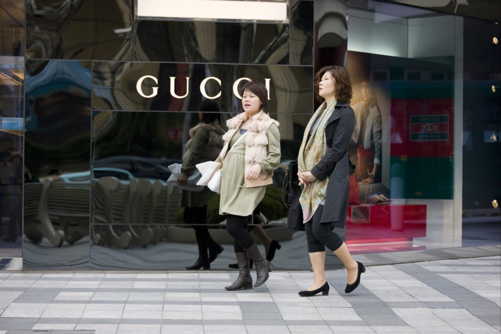 Pregnant women stroll down central Shanghai’s Nanjing Road. Photo: Getty Images