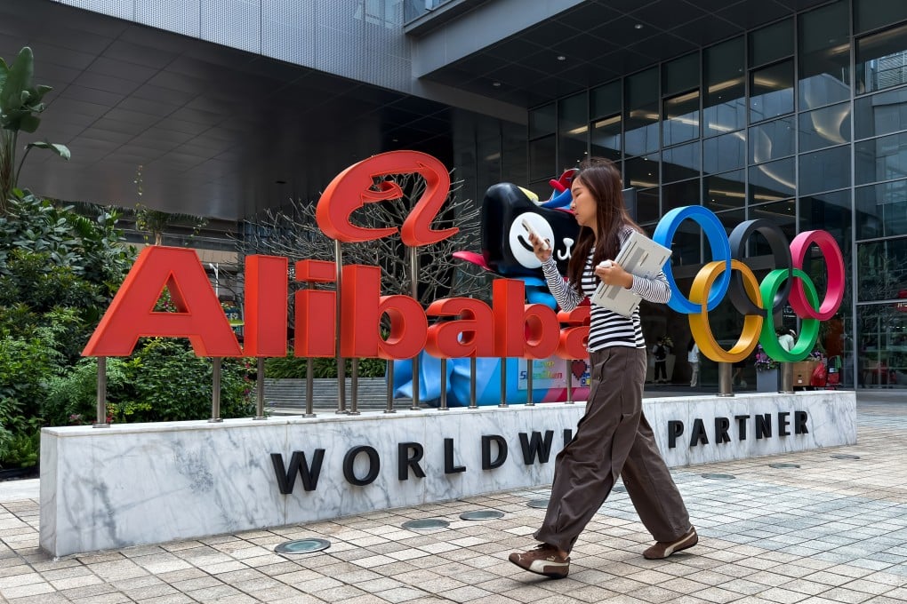 A woman walks past an Alibaba Group sign at an office complex in Shenzhen, in southern China’s Guangdong province, on March 25, 2026. Photo: Getty Images