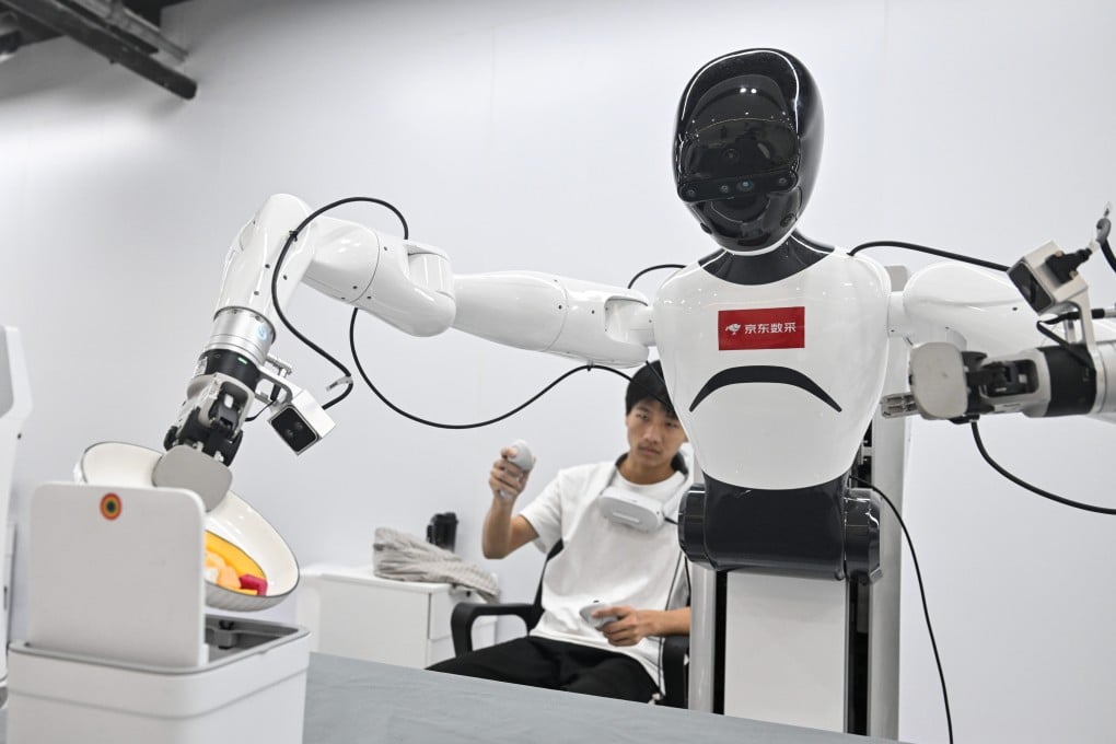 A technician trains a robot at a JD.com data collection centre in eastern China’s Jiangsu province on August 24. Photo: Xinhua