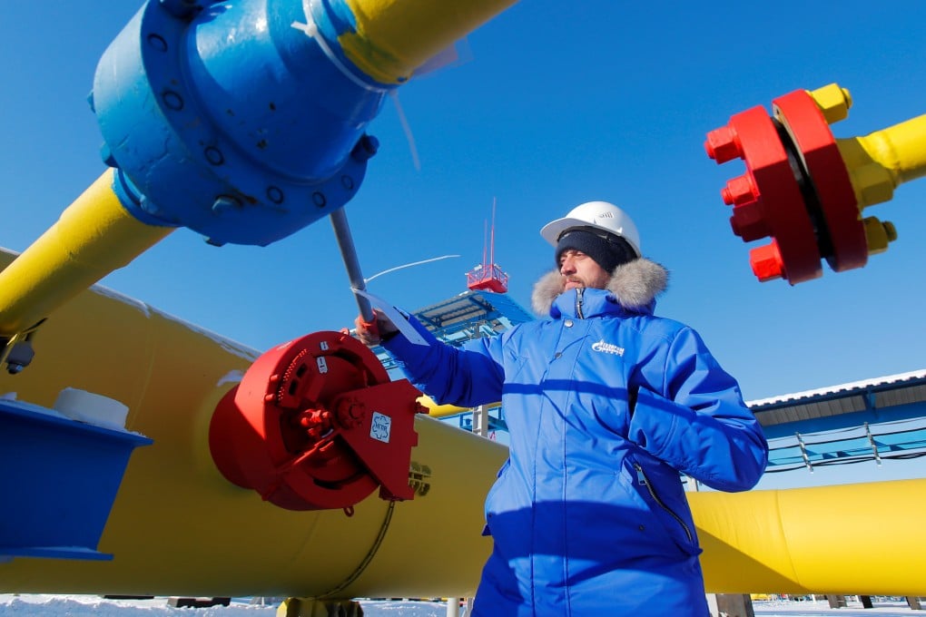 An employee checks a gas valve at the Atamanskaya compressor station, part of Gazprom’s Power of Siberia 1 gas pipeline outside the far eastern town of Svobodny, in Amur region, Russia. Photo: Reuters