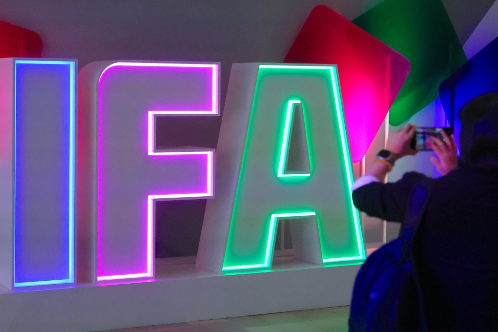 A woman takes a picture at the IFA trade fair in Berlin on Friday. Photo: EPA