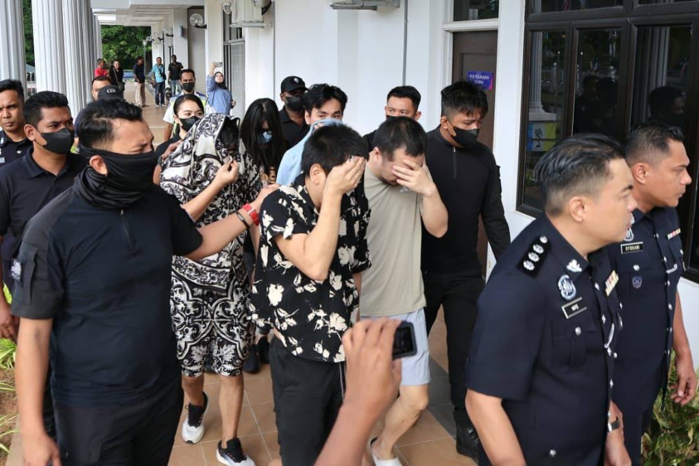 The suspects arrive at a court in Penang, Malaysia. Photo: The Star