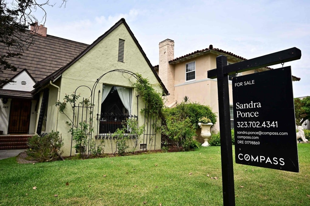 A “For Sale” sign is posted beside property for sale in Alhambra, California. Photo: AFP
