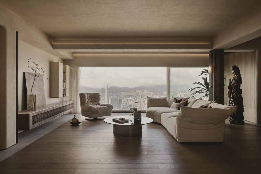 The living room in the 2,500 sq ft Peak apartment, with a view over Victoria Harbour into Kowloon. Soil Studios helped transform the 1960s-built home into a multigenerational spiritual sanctuary. Photo: Studio Periphery