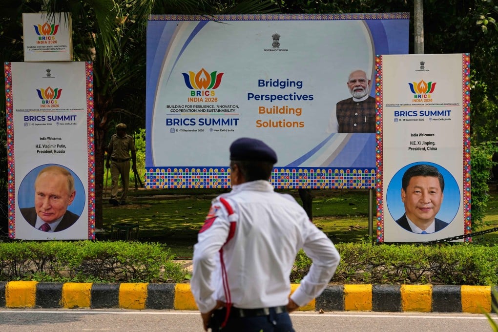 Security officers stand guard beside Brics summit banners bearing images of Indian Prime Minister Narendra Modi, Russian President Vladimir Putin and Chinese President Xi Jinping in New Delhi, India, on September 11. Photo: AP