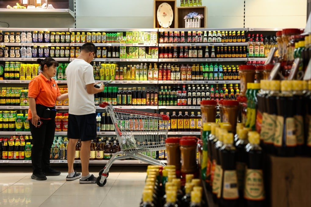 A man shops at a supermarket in Beijing. Photo: EPA