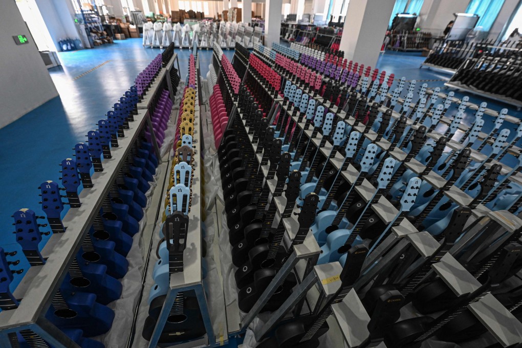 Rows of newly made guitars at a factory Zhengan, Guizhou province, in July. Photo: AFP