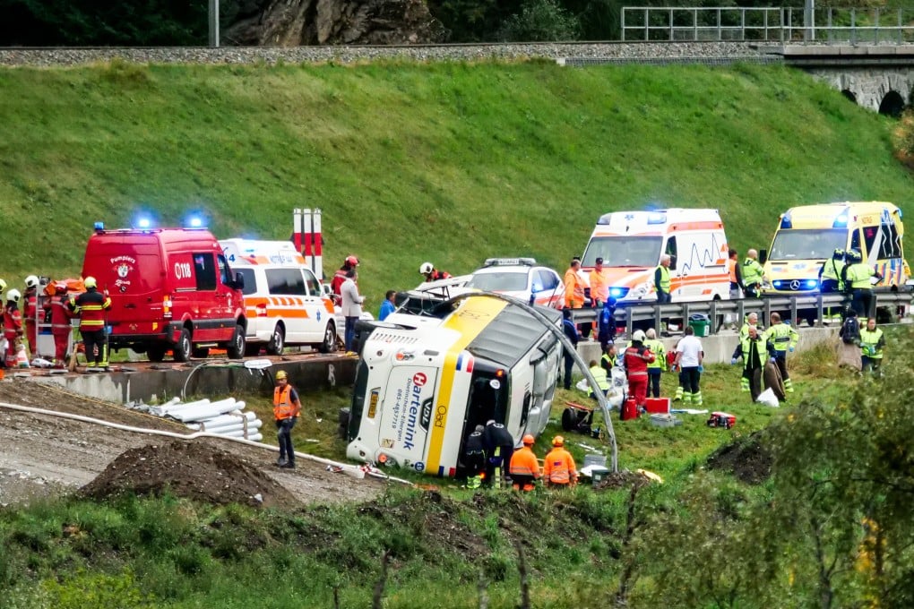Emergency personnel respond to an accident involving a tour bus near Susch, in the canton of Grisons, Switzerland, on Thursday. Photo: Engadiner Post/Keystone via AP