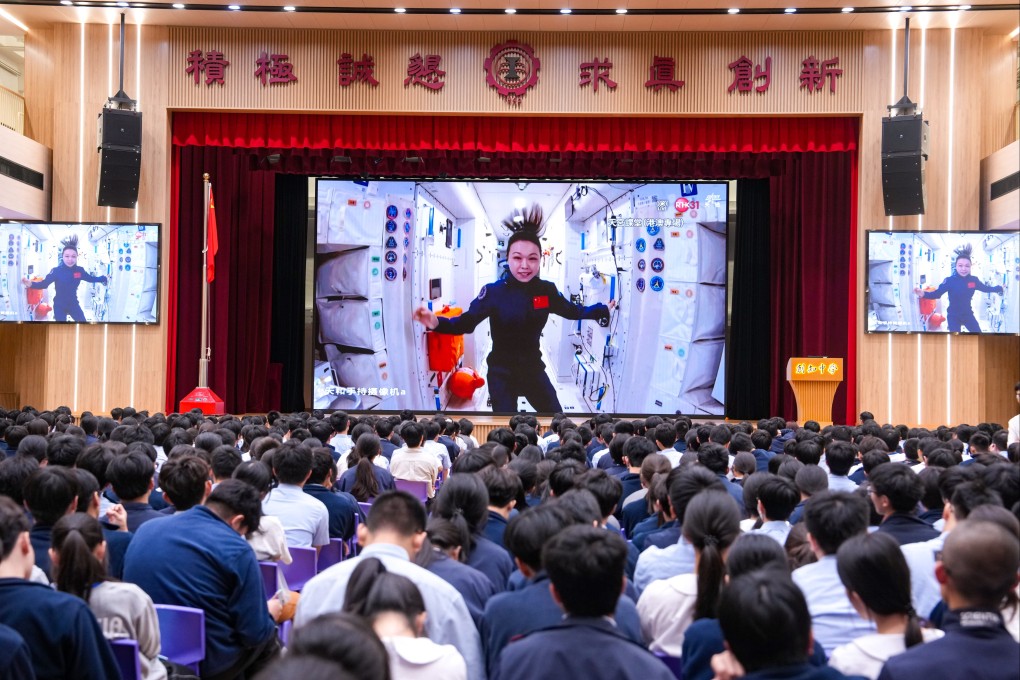 Students of Scientia Secondary School watch a live lecture by astronaut Lai Ka-ying from space on September 9. Photo: Sam Tsang