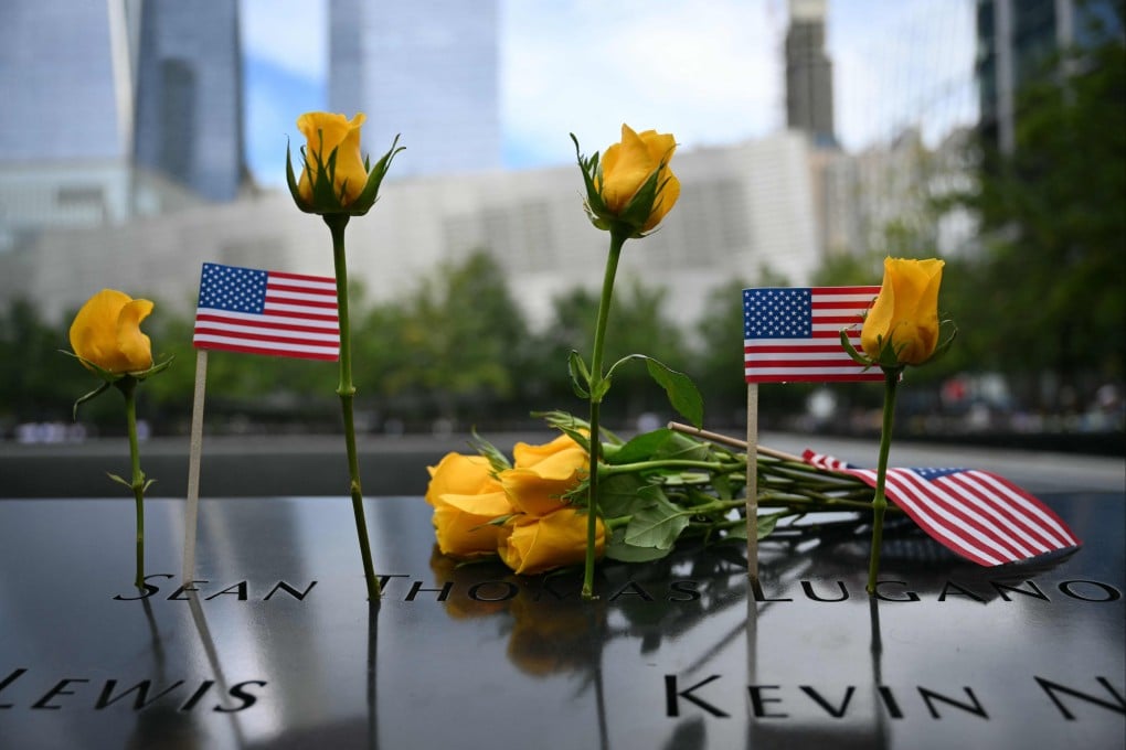 Flowers are left at the memorial during the 25th anniversary commemoration of the September 11 attacks in New York on Friday. Photo: AFP